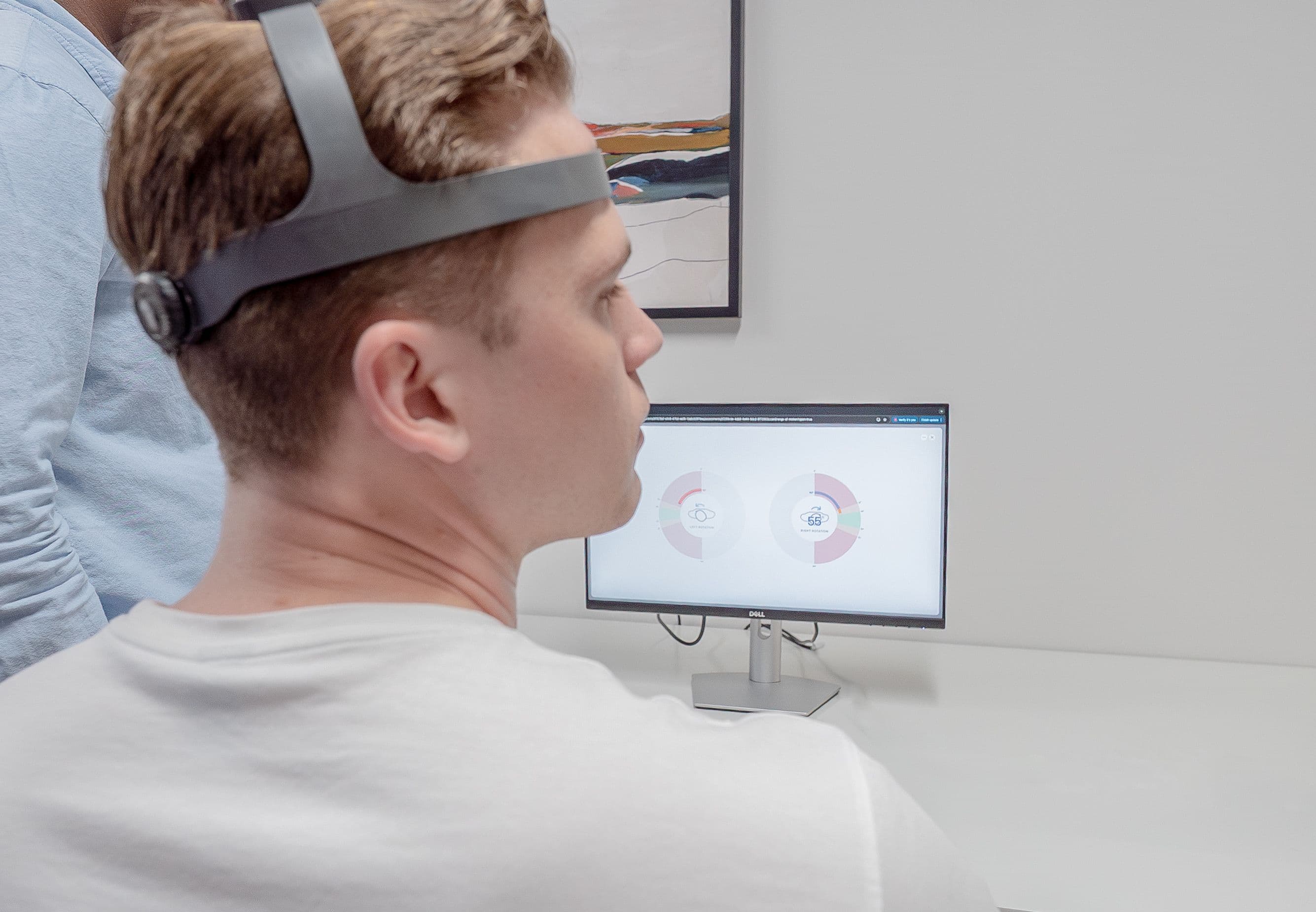 Patient using NeckCare at a chiropractic clinic